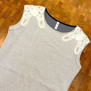 Target bodycon dress with lace appliqué on shoulders.